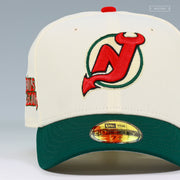 NEW JERSEY DEVILS THE DEVILS LEGION OFF WHITE FIELD GREEN NEW ERA FITTED CAP