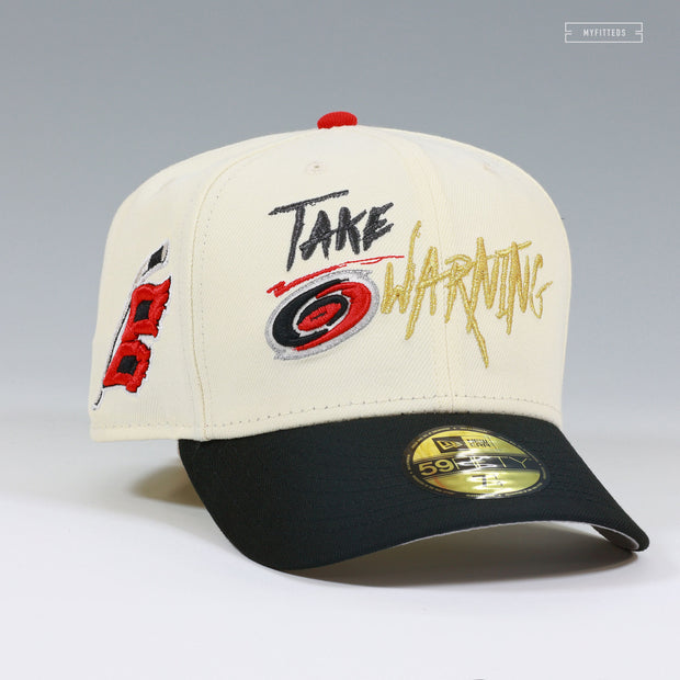 CAROLINA HURRICANES NHL TAKE WARNING OFF WHITE GITD NEW ERA FITTED CAP